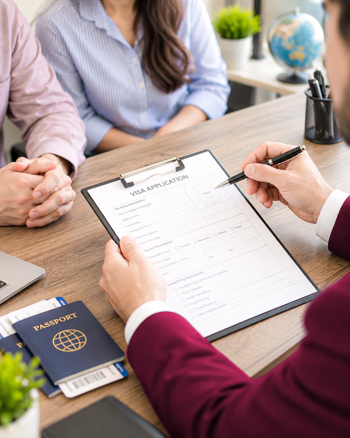 Visa adviser reviewing an application with a traveler